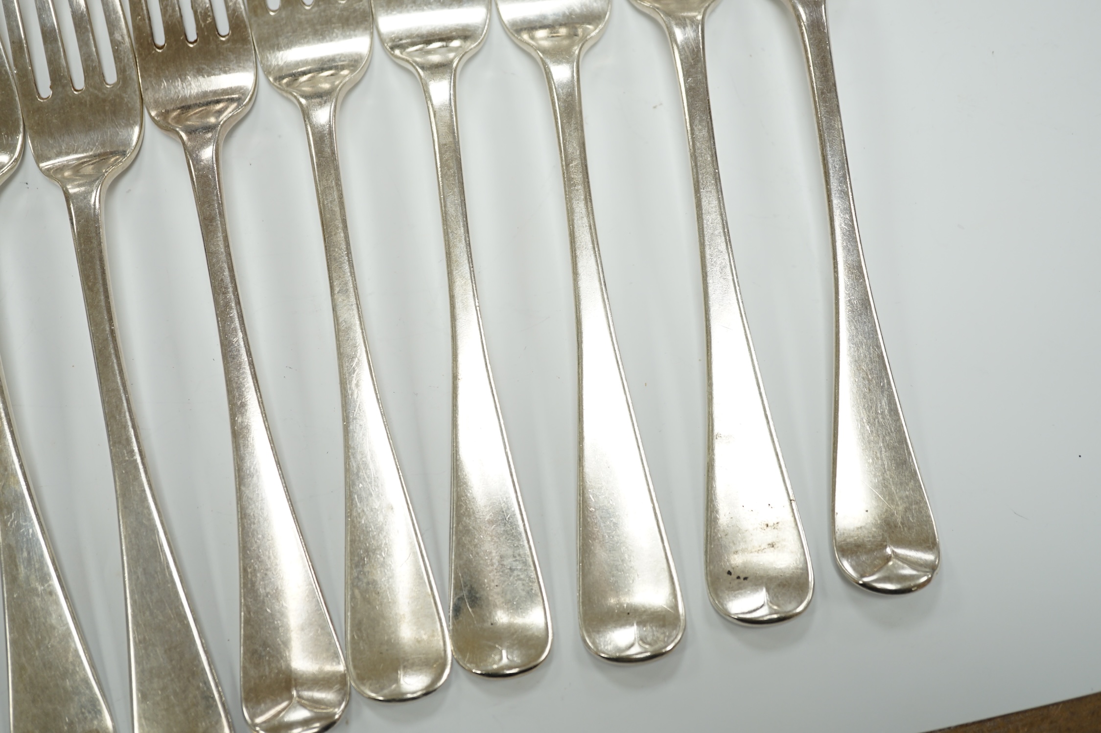 A set of six George IV silver table forks, London, 1824 and a later similar Victorian set, London, 1837, 25.8oz.